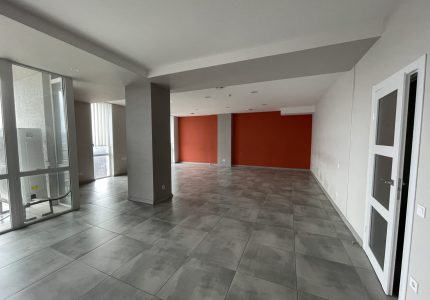 empty office with windows and red wall